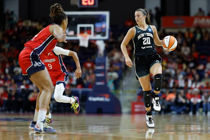 New York Liberty guard Sabrina Ionescu dribbles the basketball.